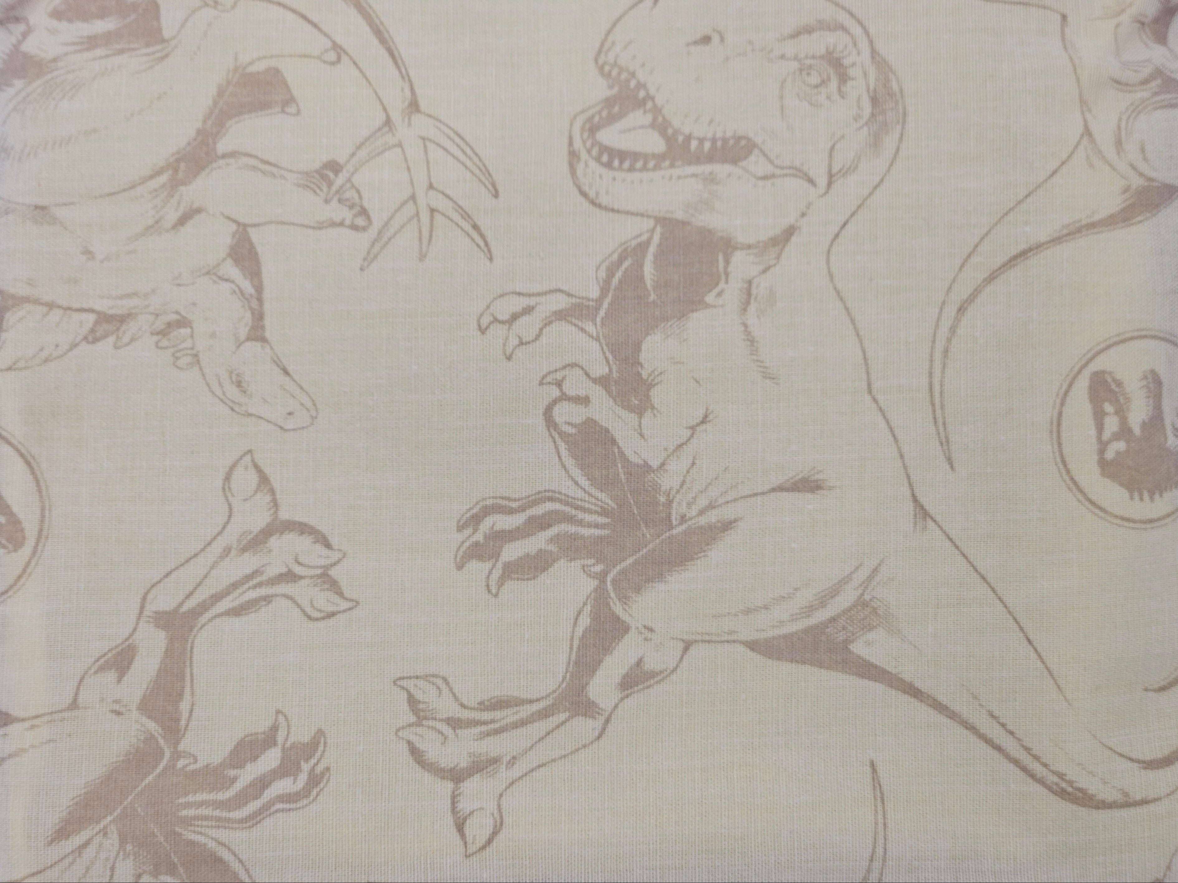 Pattern of dinosaurs and plants on a beige background