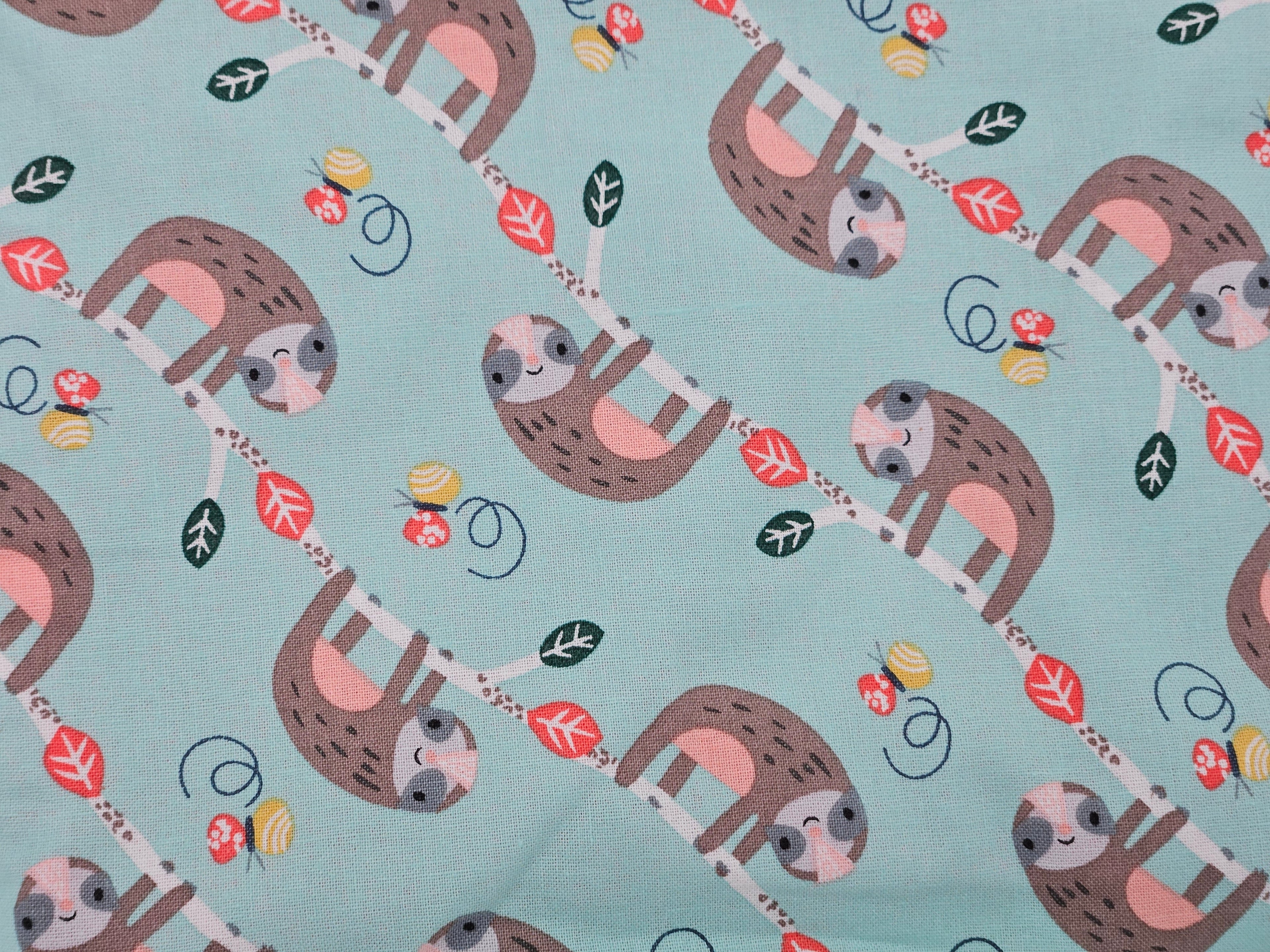Pattern of sloths on a light blue background